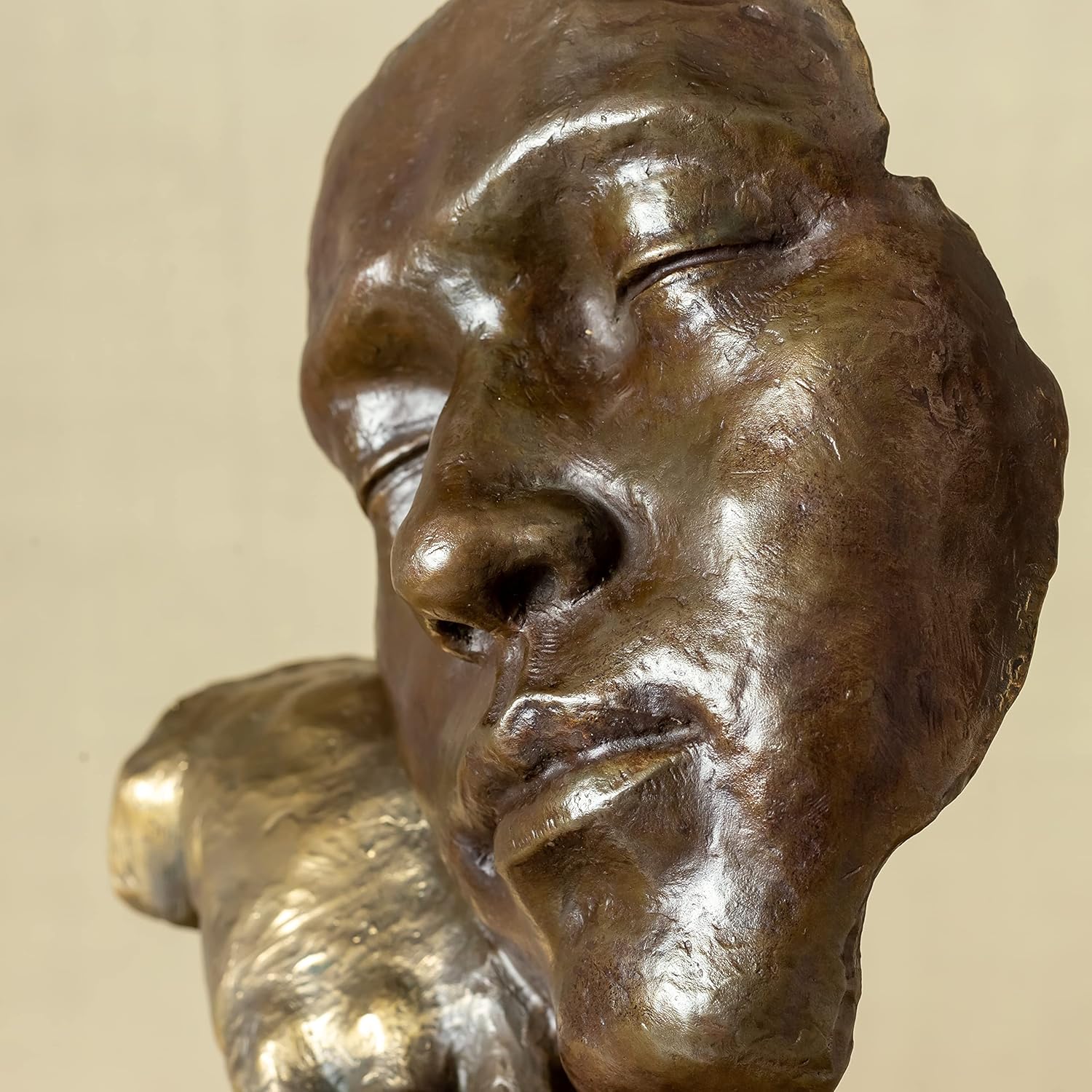 Hand and face detail of Deep Reflection bronze abstract thinker statue showing casting texture