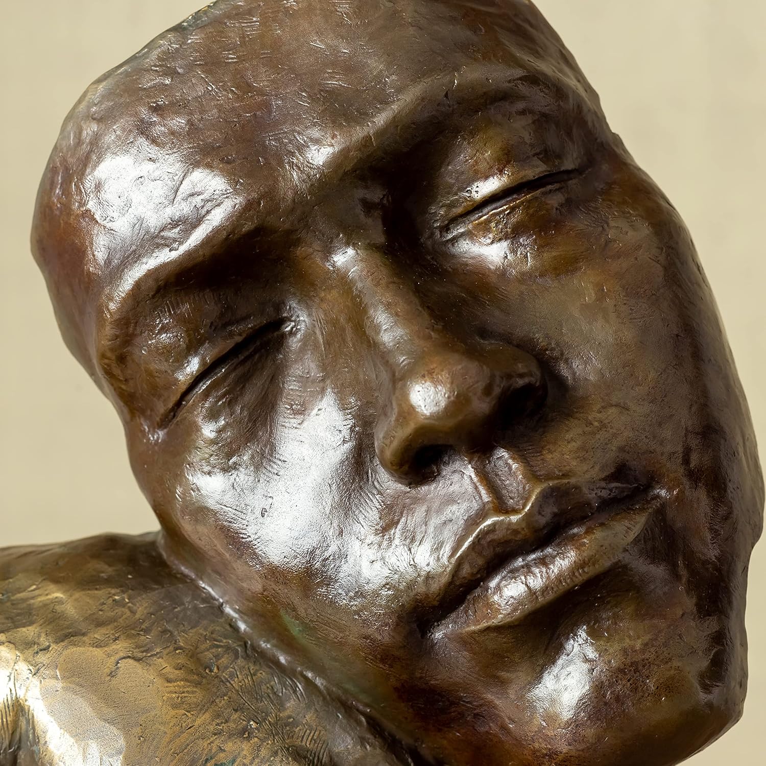 Rear angle view of Deep Reflection abstract bronze thinker statue on black marble base