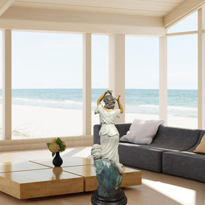 Demeter goddess bronze statue in modern living room with ocean view as luxury indoor mythology decor