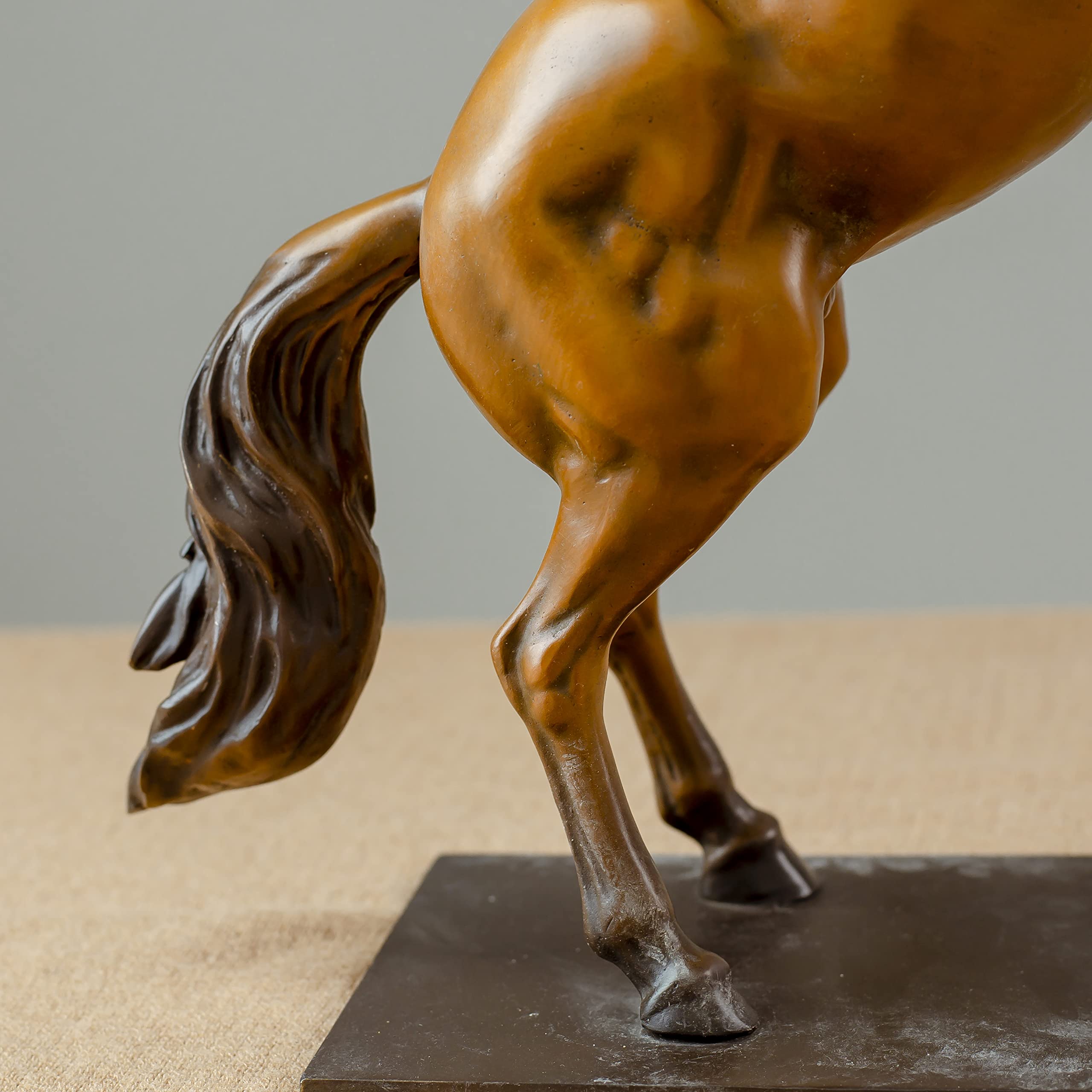 Gold bronze rearing stallion desk edition sculpture full body view on wooden desk showing tail