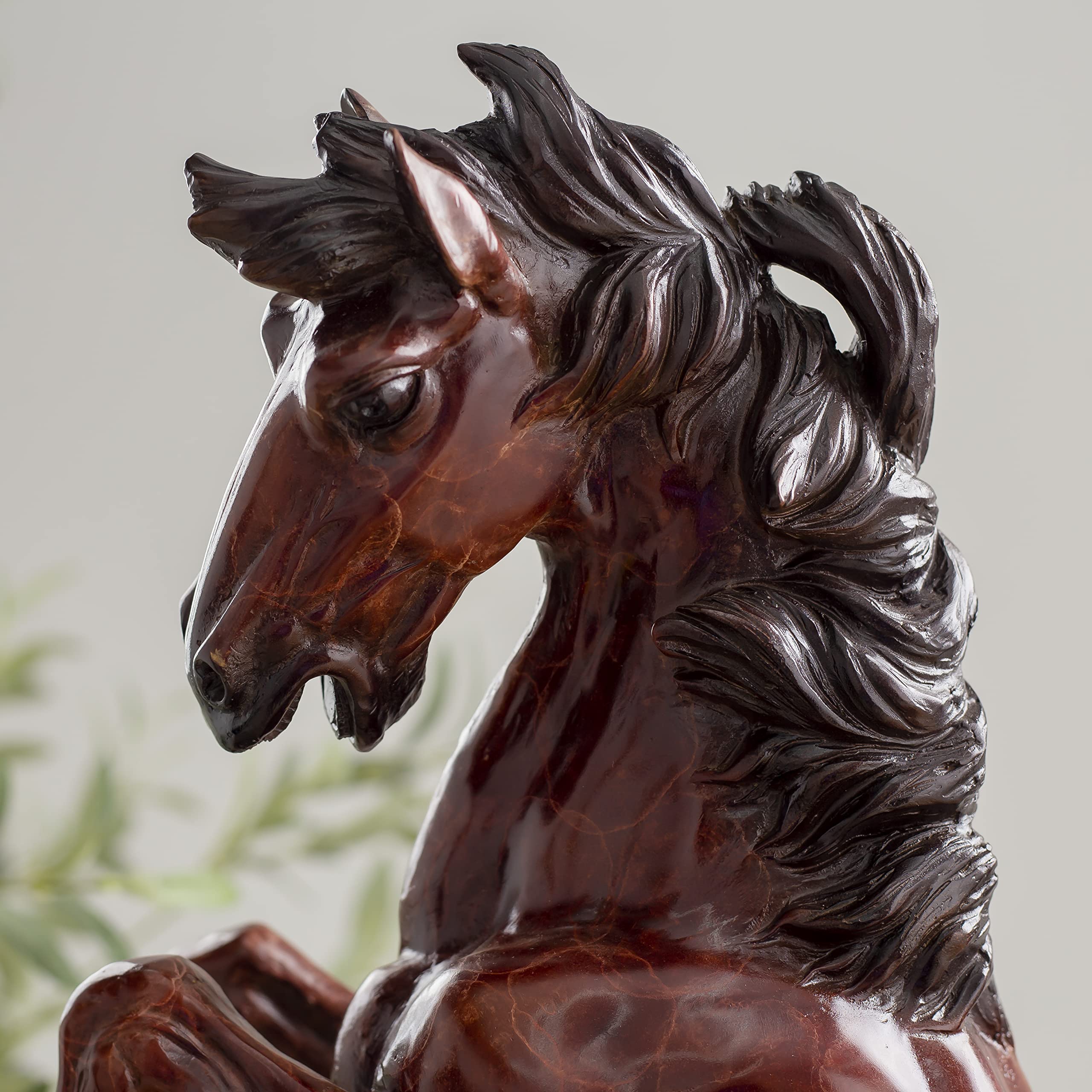 Close-up detail of elite rearing stallion bronze sculpture head and neck showing dark mane texture