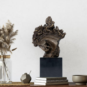 "Flames of Spirit" bronze horse head sculpture displayed with dried flowers and books in indoor setting
