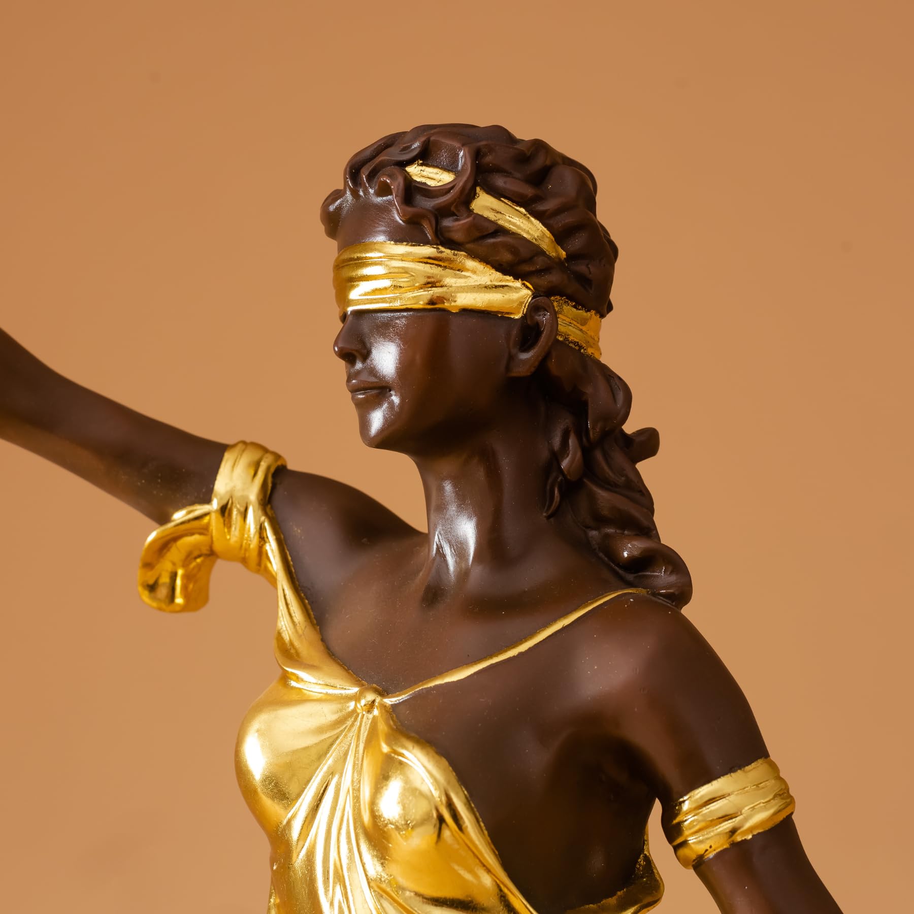 Back full body view of 28.3-inch gilded bronze Lady Justice Themis statue on warm brown background