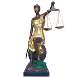 Gilded bronze Lady Justice Themis statue front full body view on warm brown background showing scales raised