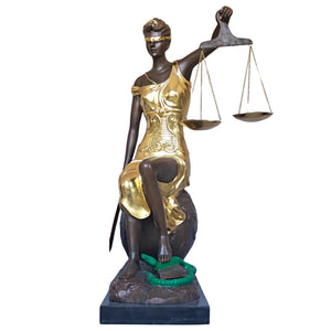Gilded bronze Lady Justice Themis statue front full body view on warm brown background showing scales raised