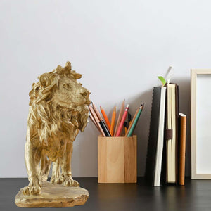 Gold Lion King bronze statue displayed on office desk alongside stationery as executive decor