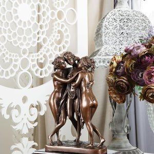 Elegant Greek goddesses art deco sculpture enhancing a professional office desk environment.