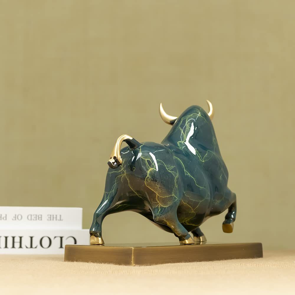 Artistic green enamel glaze texture on charging bull figurine.