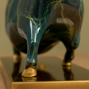 Macro shot of the unique enamel glaze pattern on green bull.