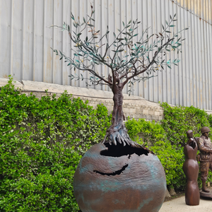 3-meter-tall large custom bronze olive tree earth globe sculpture undergoing final quality inspection in our professional manufacturing facility.