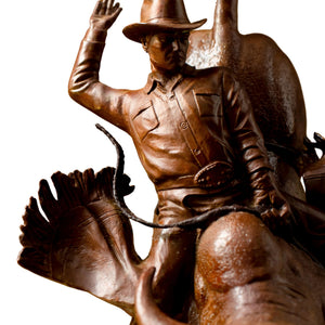 High-resolution details of the red-brown patina on handcrafted western art bronze sculpture