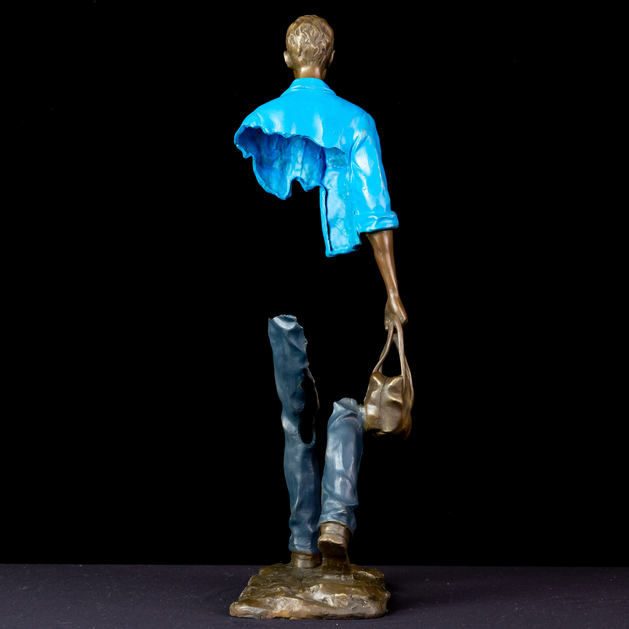 Detailed shot of the high-quality cast bronze with light blue hand-painted patina.