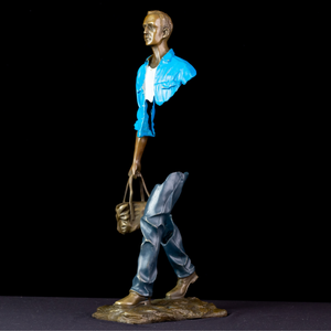 Close-up of the iconic hollow torso design on the light blue standing voyageur.