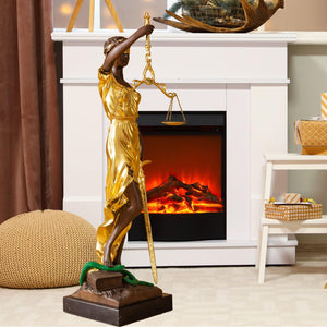 Large gold bronze Lady Justice Themis statue displayed beside fireplace and bookshelf in warm interior
