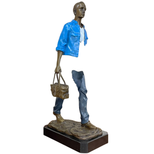 Intricate facial detail and bronze craftsmanship of the large standing voyageur art piece.