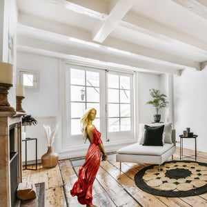 Luo Li Rong silk dancer bronze statue red dress rustic interior large window natural light