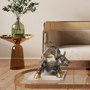 Luxury bronze charging bull with artistic pattern displayed in home office
