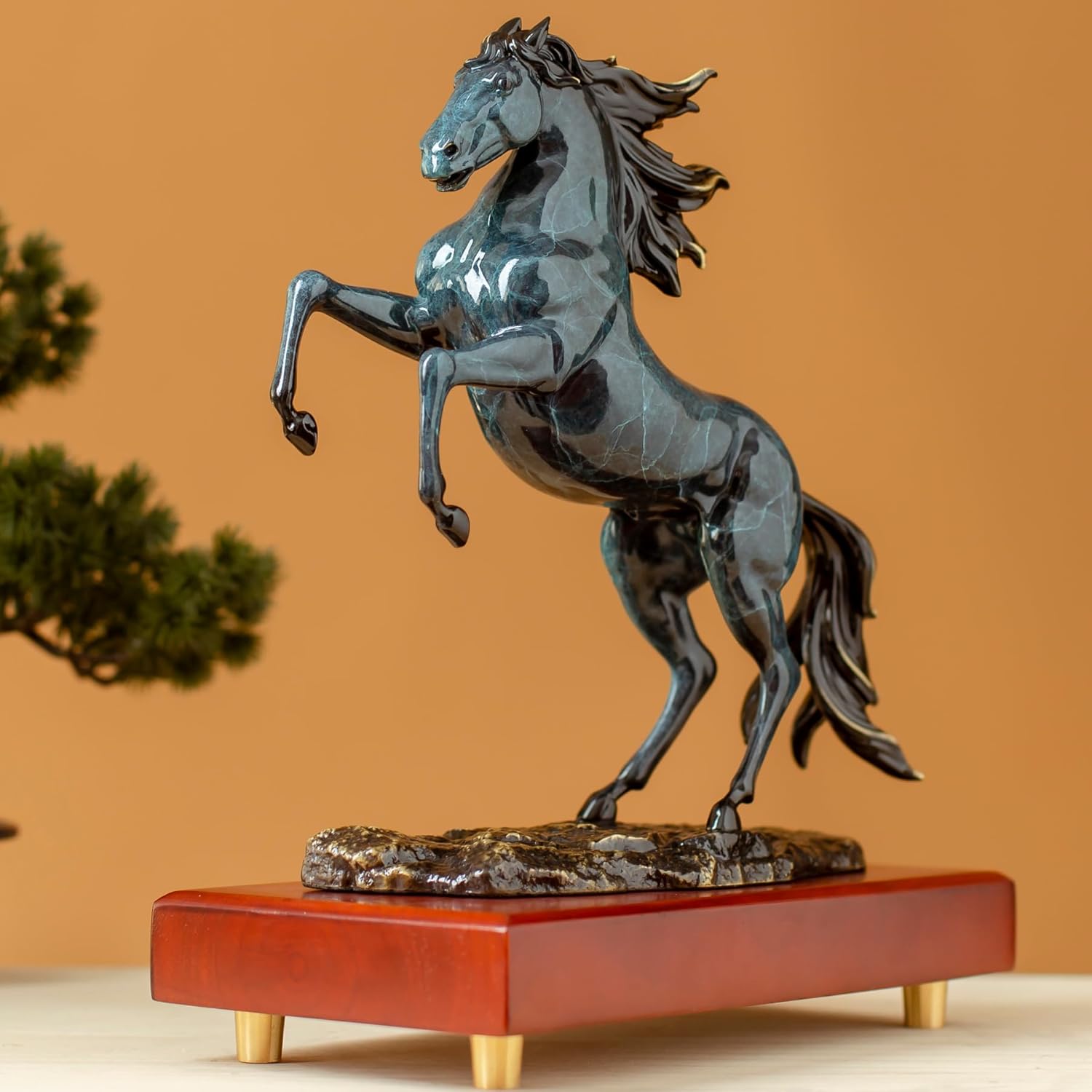 Azure blue rearing horse bronze sculpture back angle view showing flowing mane texture