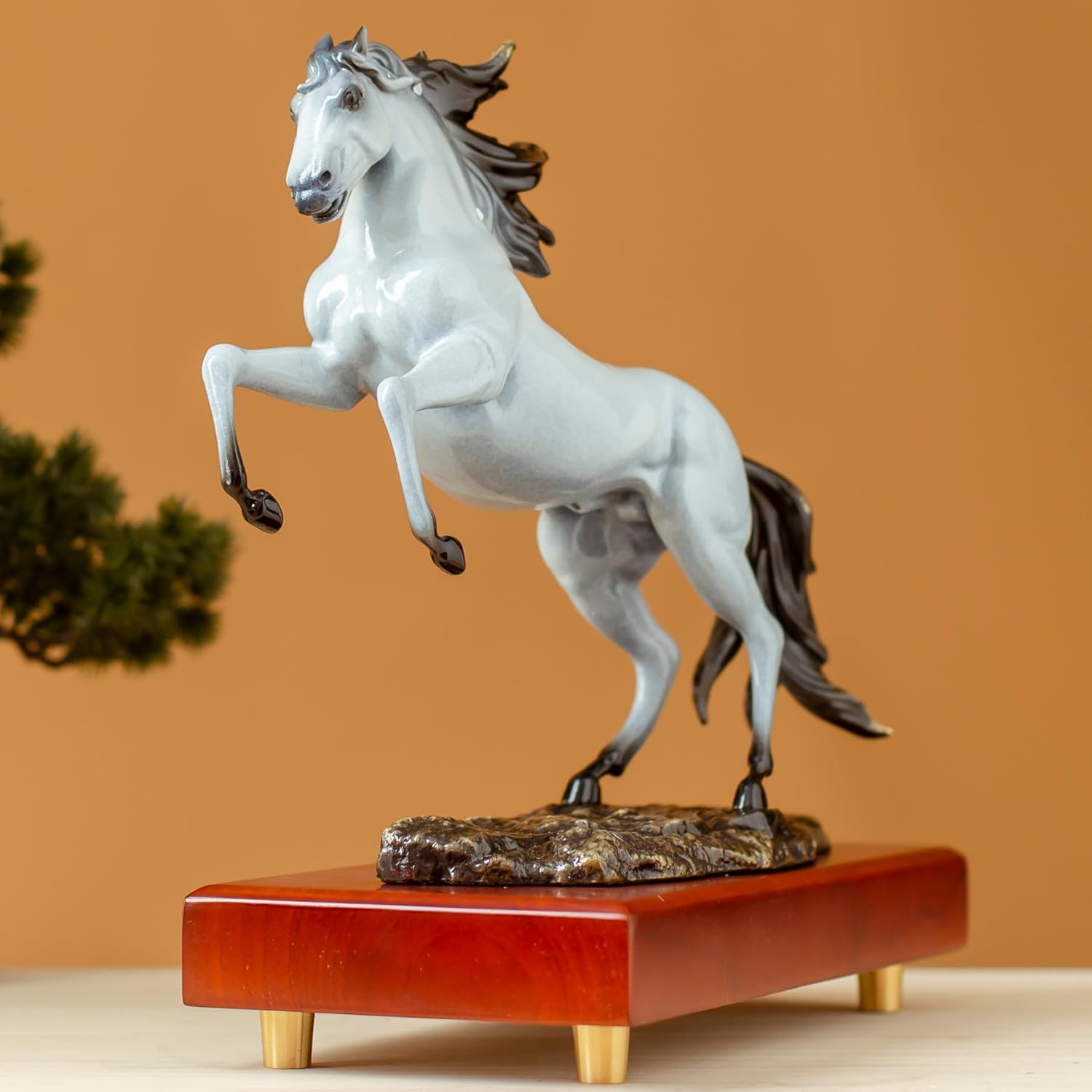 Pearl white rearing horse bronze sculpture front angle view showing dynamic rearing pose