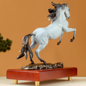 Second side view of pearl white rearing horse bronze sculpture on wood base