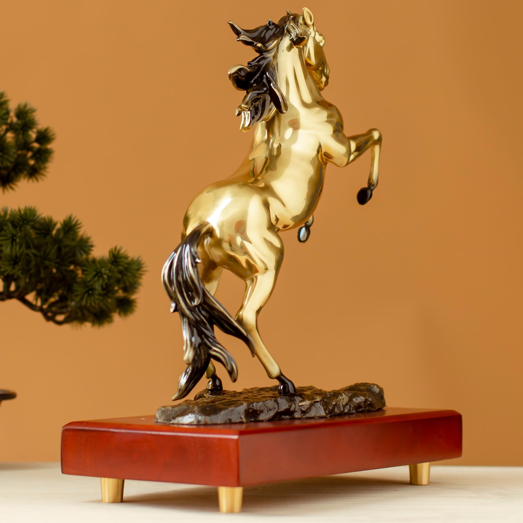 Second angle view of radiant gold rearing horse bronze sculpture on premium wood base