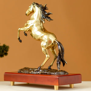 Radiant gold rearing horse bronze sculpture back angle view showing flowing mane and tail
