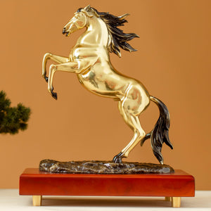 Second front view of radiant gold rearing horse bronze sculpture on wood base