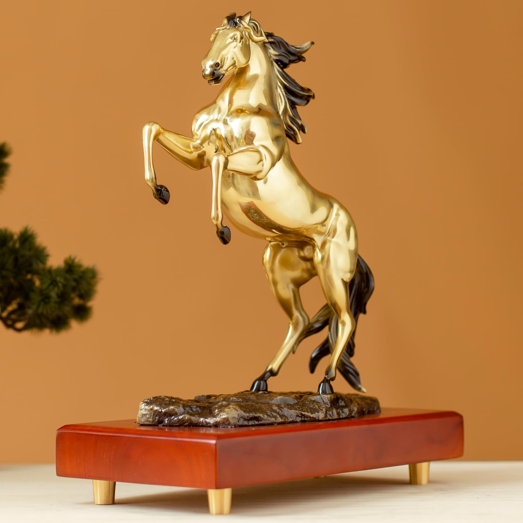 Radiant gold rearing horse bronze sculpture side view showing dynamic rearing pose