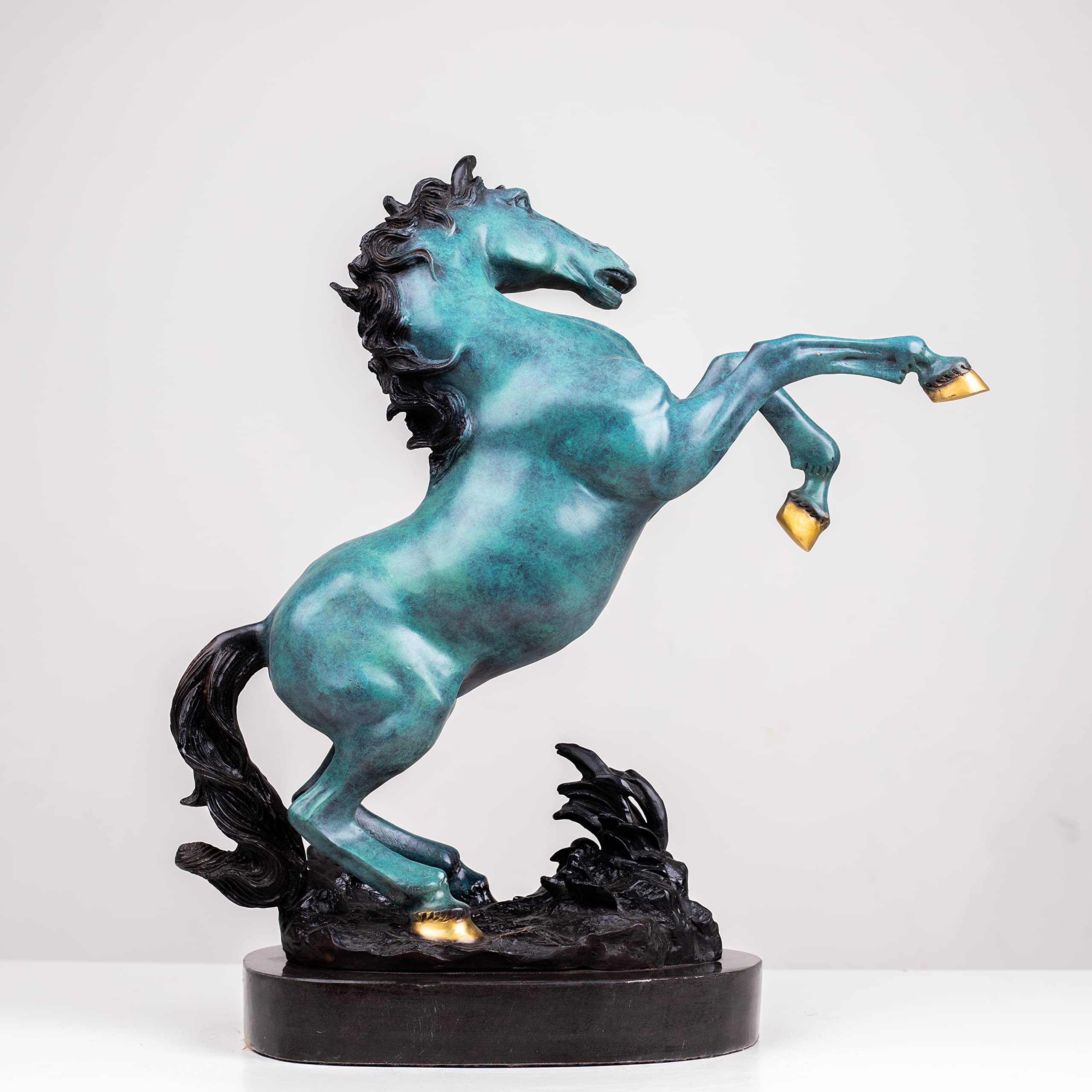 Azure blue bronze rearing stallion sculpture angle view showing gold hoof accent and dynamic pose