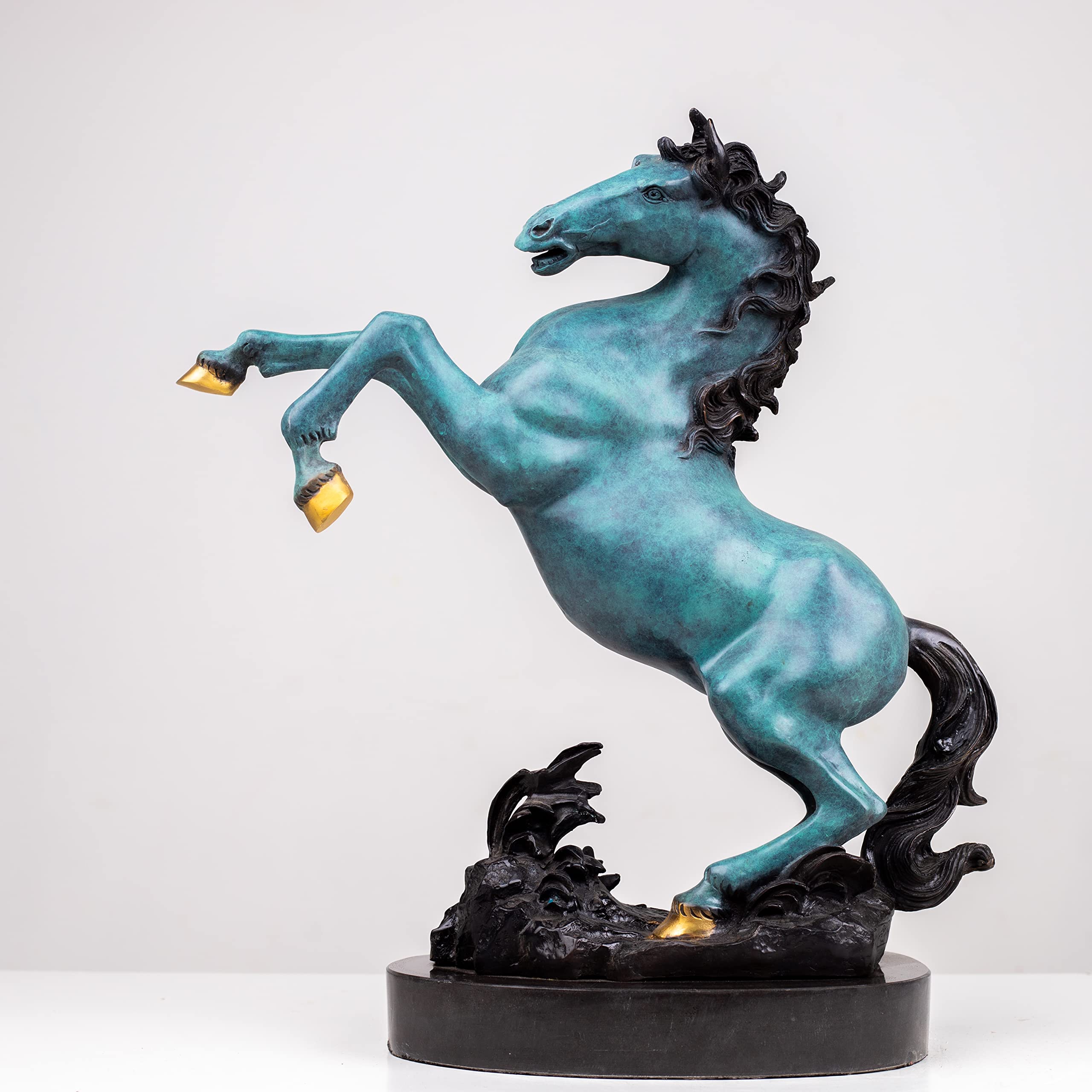 Azure blue bronze rearing stallion sculpture side view on marble base showing dynamic rearing pose