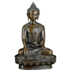 Medicine Buddha purple copper statue on dark background highlighting bronze patina and craftsmanship