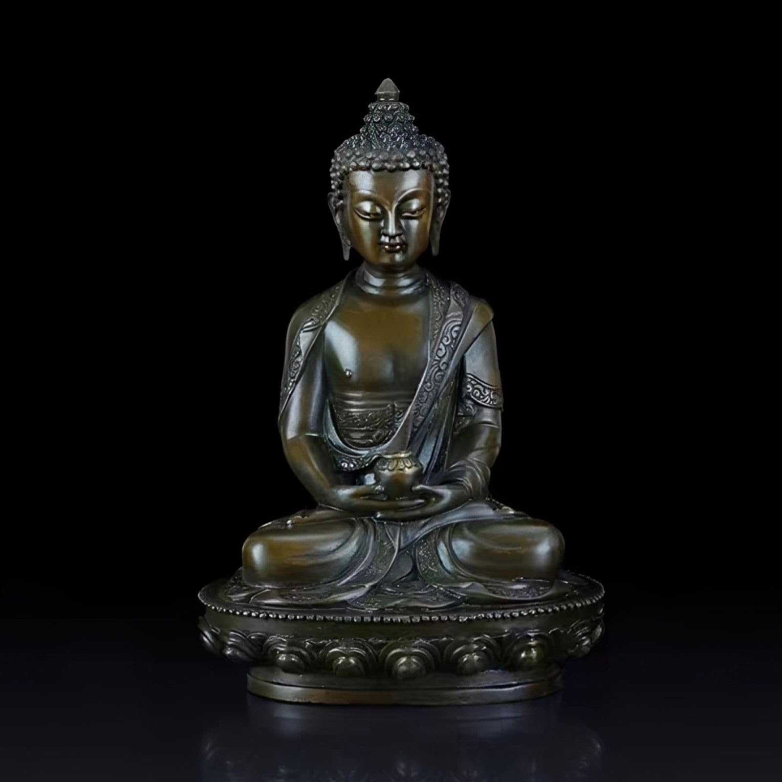Medicine Buddha bronze statue side view on dark background showing detailed robe and lotus base