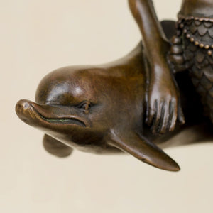 Mermaid and dolphin bronze sculpture dolphin and tail base detail close up craftsmanship