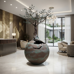 3-meter-tall bronze life tree art sculpture placed in the center of a modern luxury hotel lobby with polished marble floors.