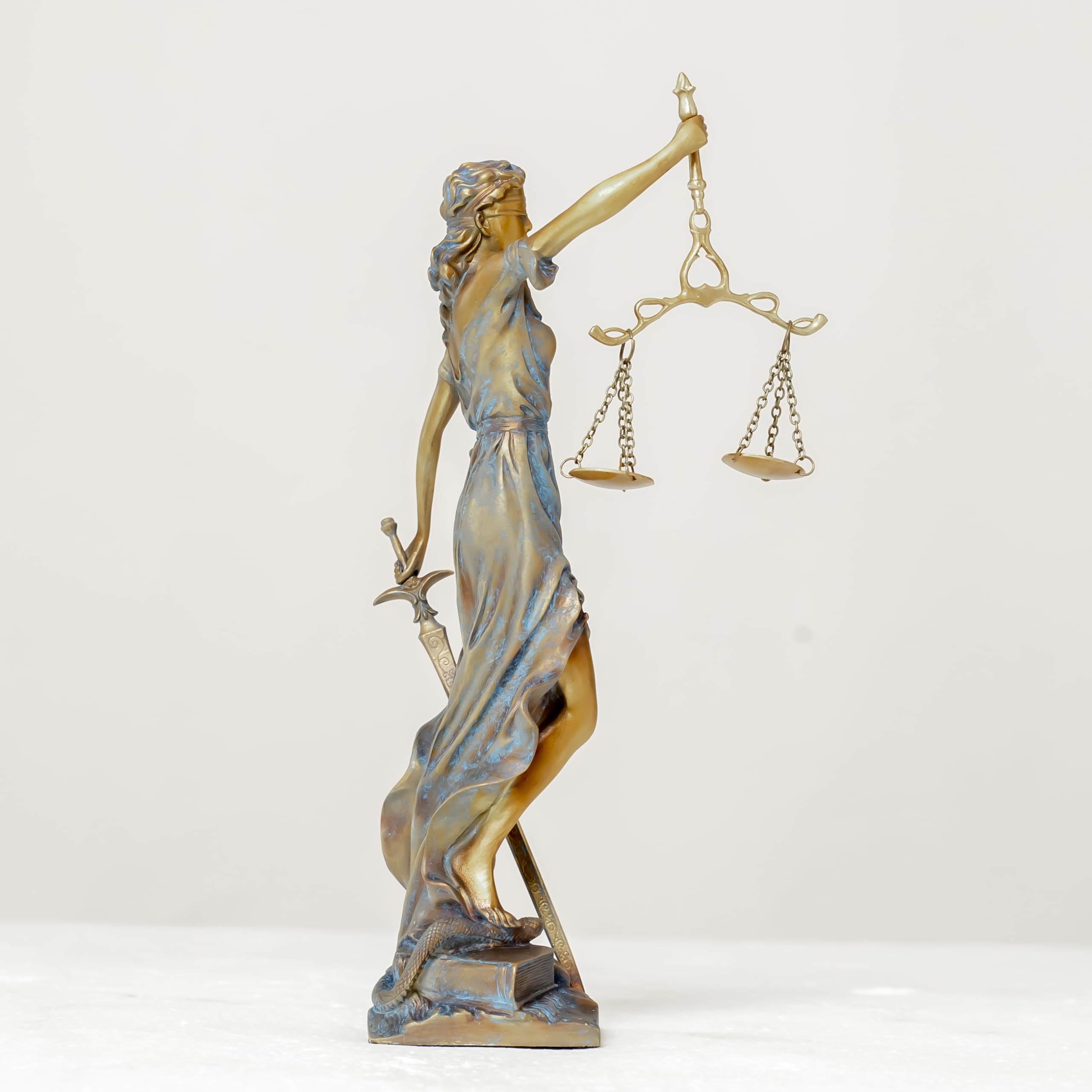 Multicolor Lady Justice Themis statue side full body view on white background