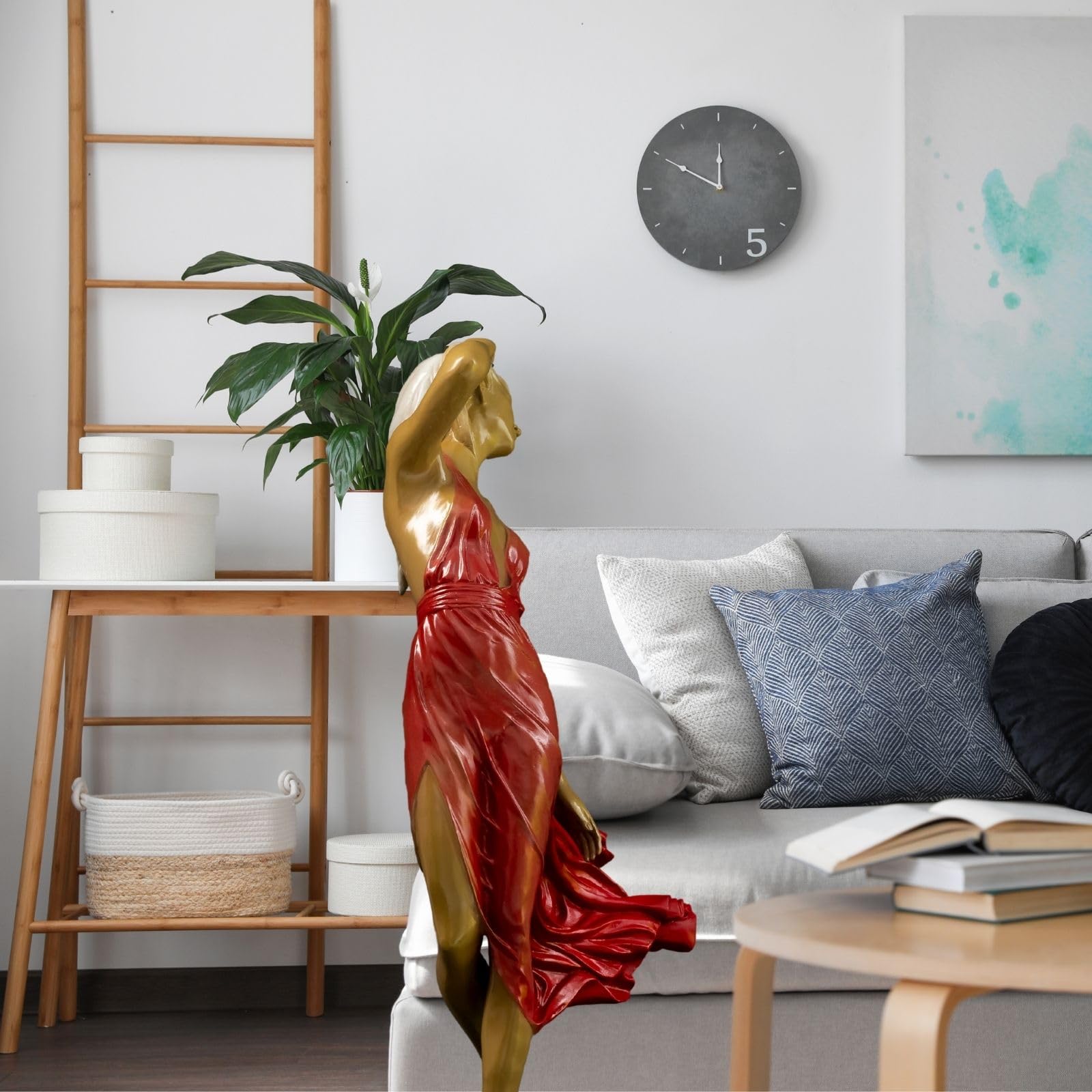 Neoclassical bronze wind dancer red dress in bright modern living room