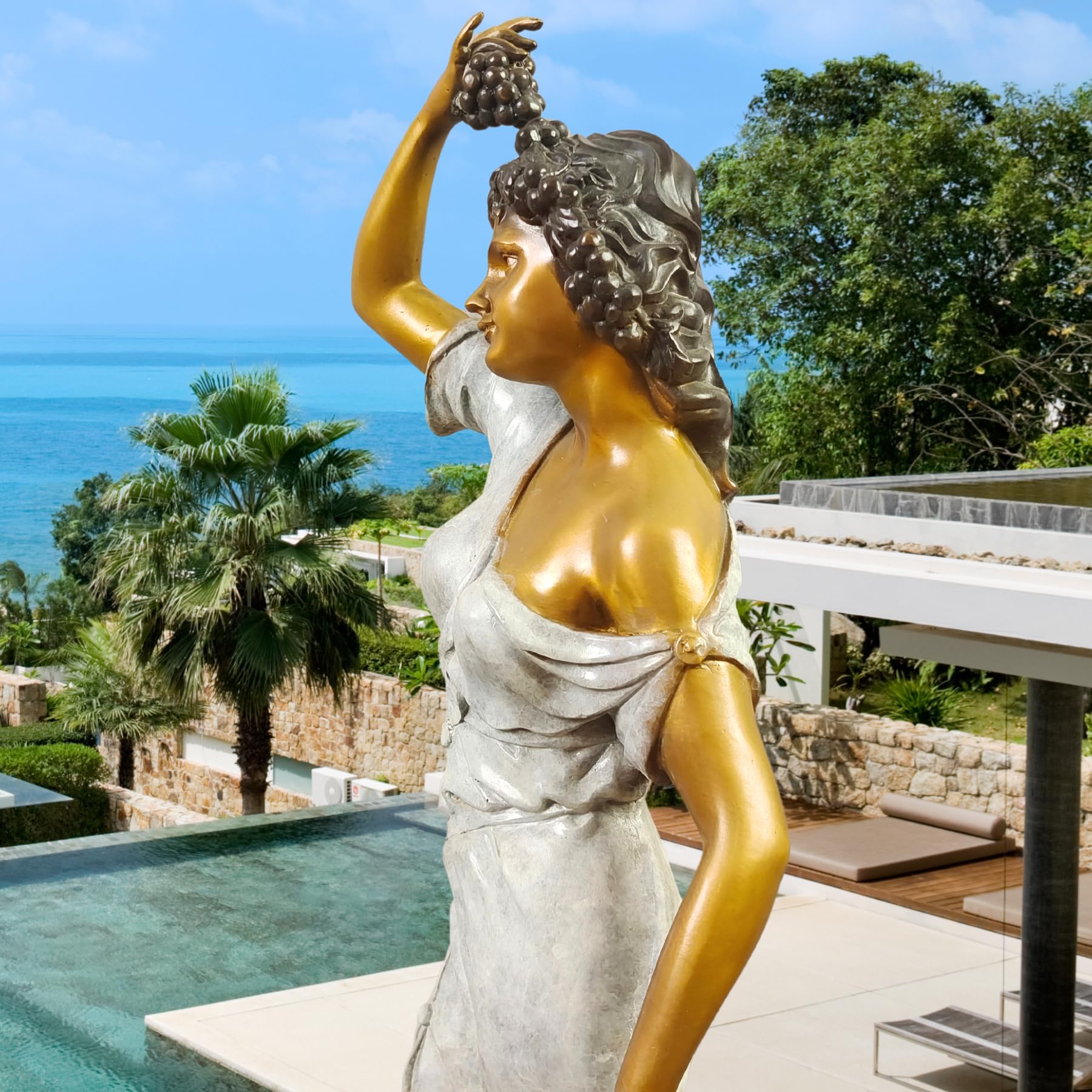 Pomona goddess bronze statue placed beside tree in courtyard showing polychrome finish and flowing gown