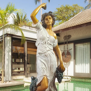 Close-up of Pomona goddess bronze statue showing detailed face expression and grape vine sculpting