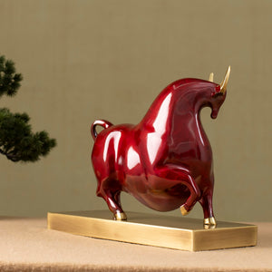 Solid brass base detail of the luxury red enamel bull.