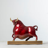Handcrafted red enamel Wall Street bull statue, front view.