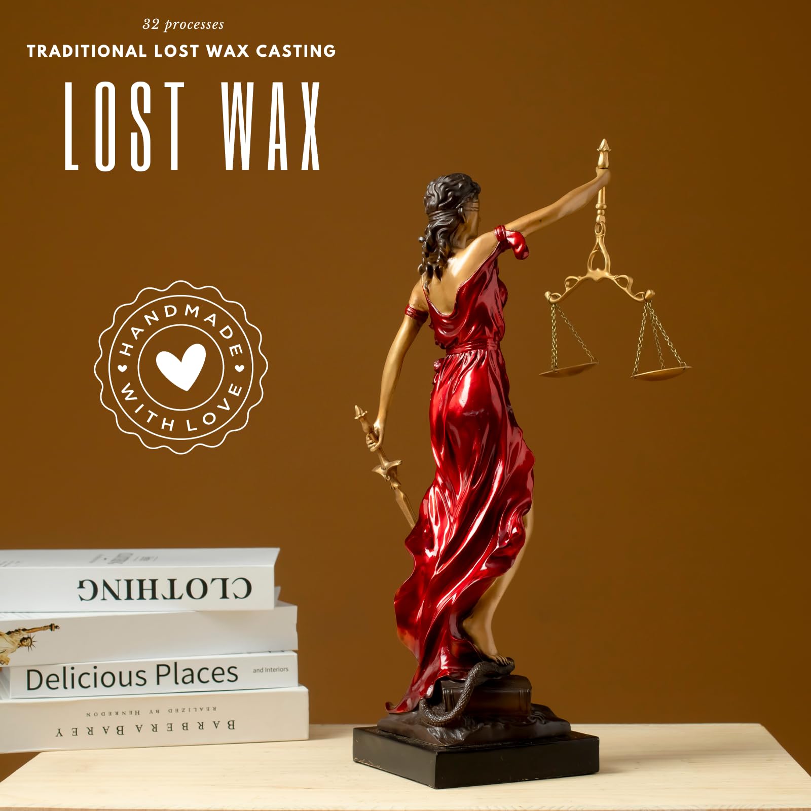 Red Lady Justice Themis statue showcasing lost-wax cast bronze craftsmanship on brown background
