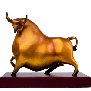 Handcrafted reddish-orange bull sculpture with wood base.