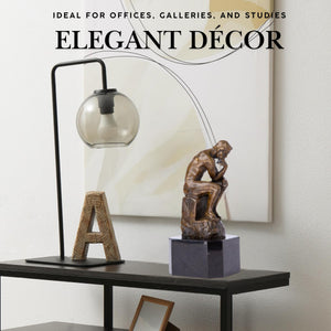 Rodin The Thinker bronze statue elegant decor feature displayed on side table beside modern lamp