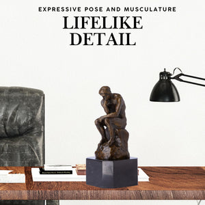 Rodin The Thinker bronze statue lifelike detail feature shown on desk beside lamp