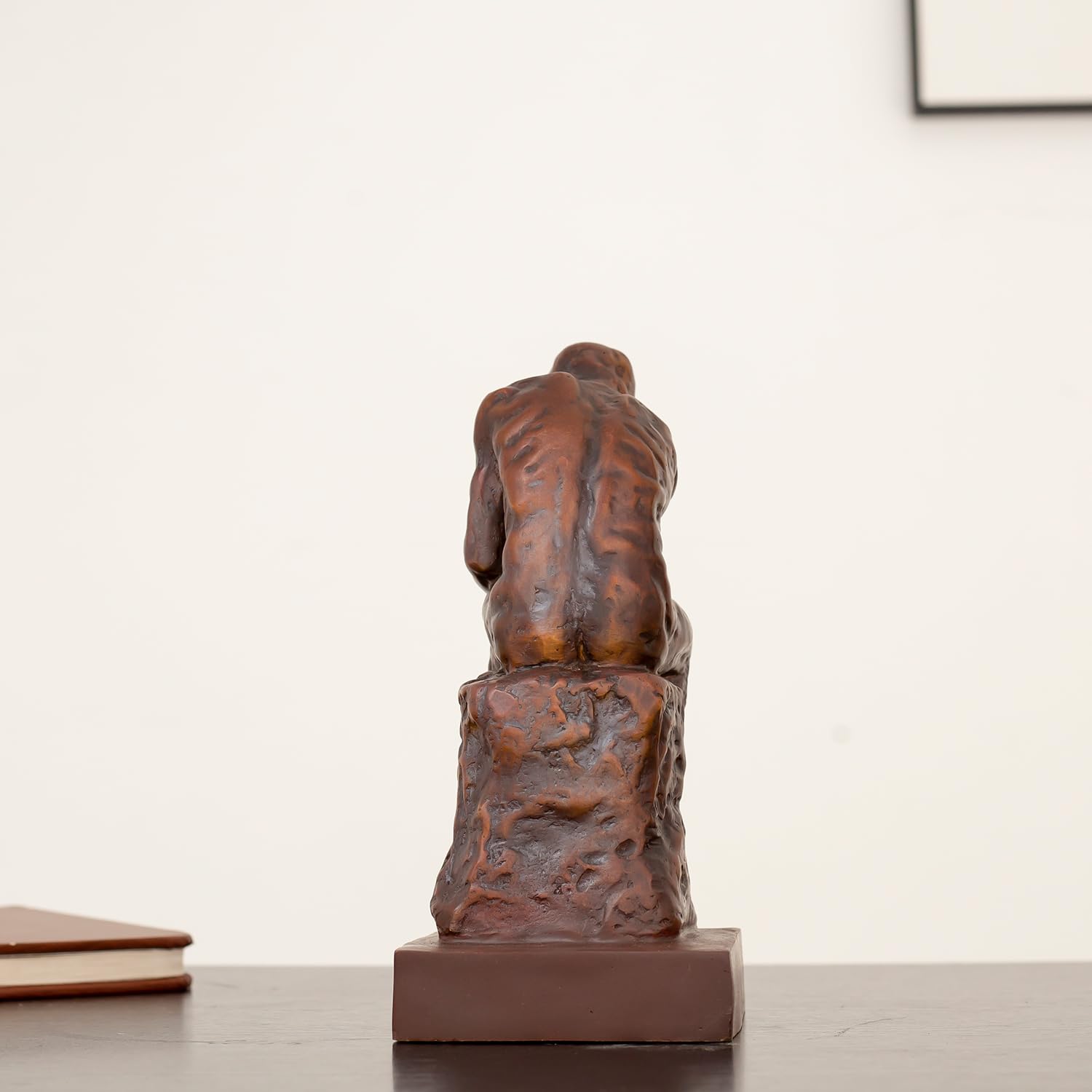 Back view of Rodin The Thinker classical bronze statue showing detailed sculpting and square base