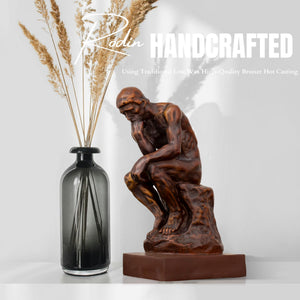 Rodin The Thinker classical bronze statue handcrafted feature beside vase with dried wheat decor