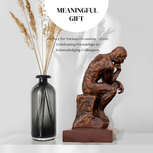 Rodin The Thinker classical bronze statue meaningful gift feature beside glass vase and dried flowers