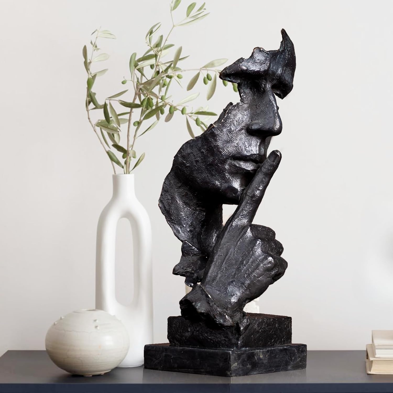 Black patina Silence is Gold thinker bronze sculpture front view with vase home display