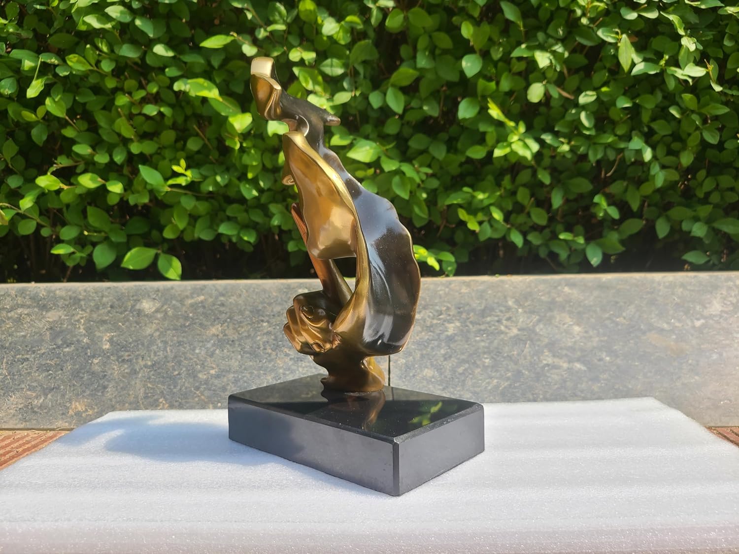 Rear view of gold Silence is Gold abstract thinker bronze statue showing full figure detail