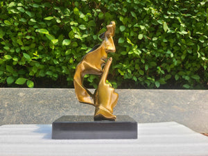 Gold finish Silence is Gold abstract thinker bronze sculpture front view on marble base